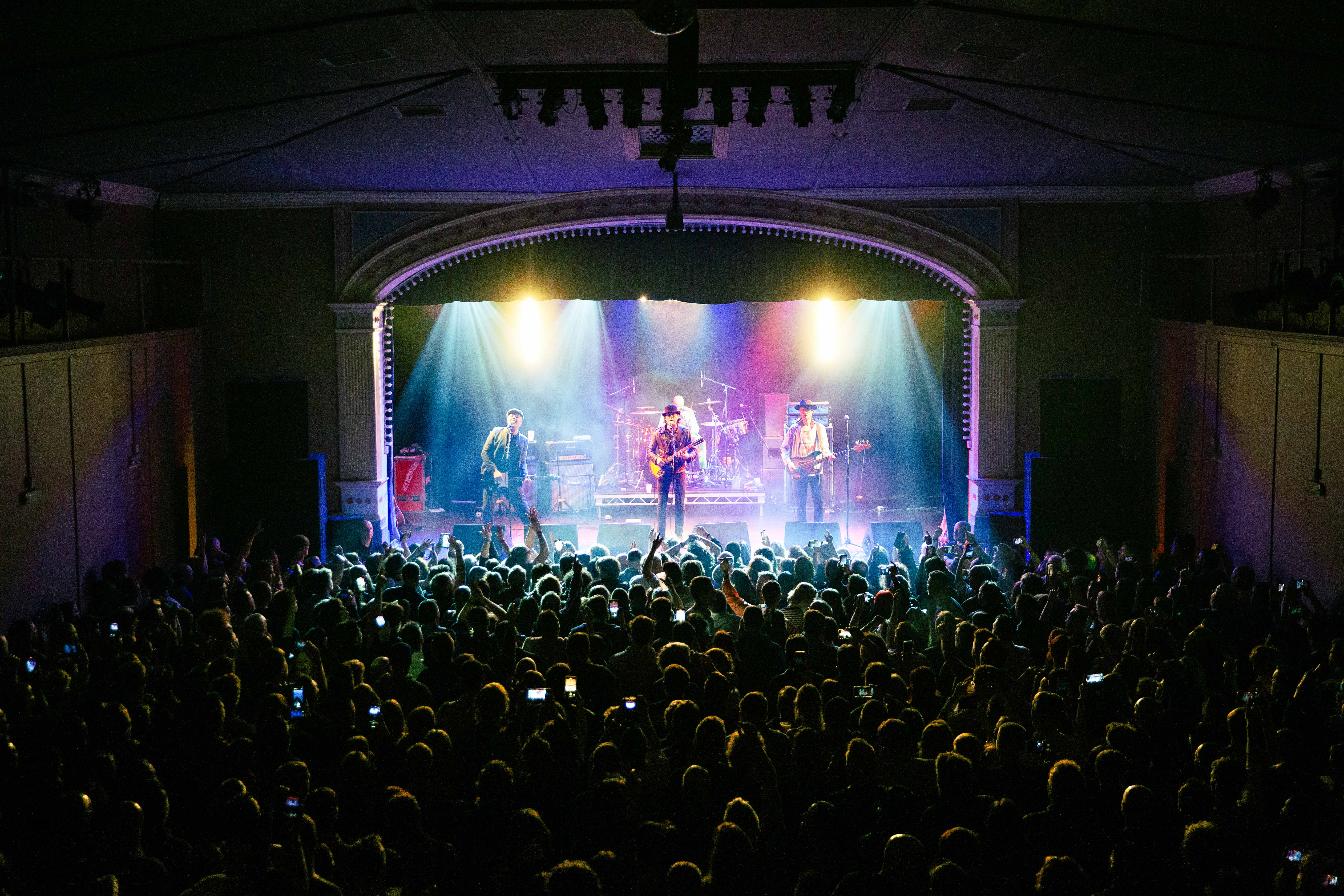 The Libertines overlooking the crowd on stage at Princess Pavilion Falmouth